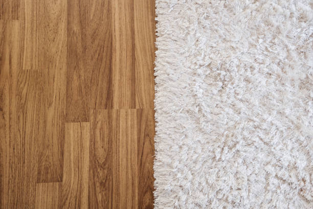 close-up luxury white carpet on laminate wood floor in living room, interior decoration - hardwood imagens e fotografias de stock