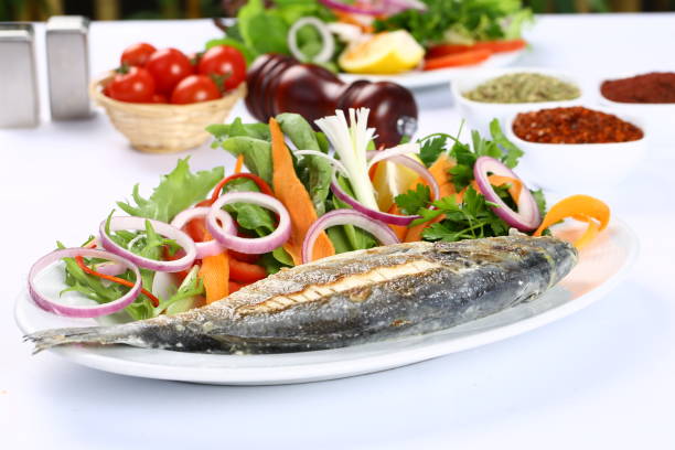 рыбное блюдо - sea bass prepared fish food grilled стоковые фото и изображения
