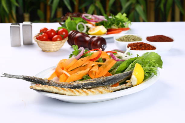 рыбное блюдо - sea bass prepared fish food grilled стоковые фото и изображения