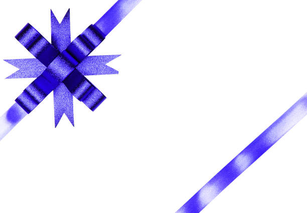 Close-up of a gift box with ribbon and bow in blue tones.