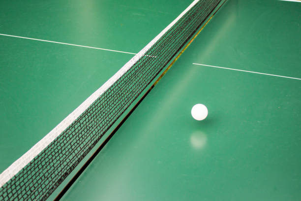 istock Table tennis, ping-pong table and the white ball on a green table. 843131218