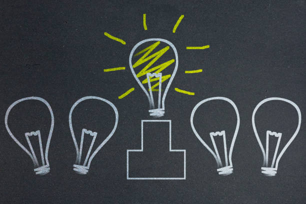 istock Concepts of idea with light bulb on blackboard 843134630