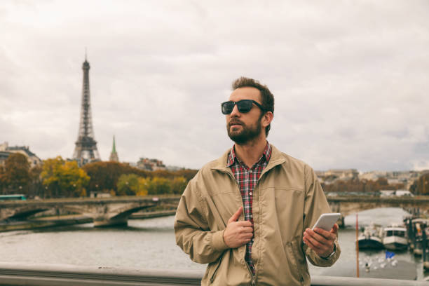 istock Modern guy using cellphone in the European city. 843136788