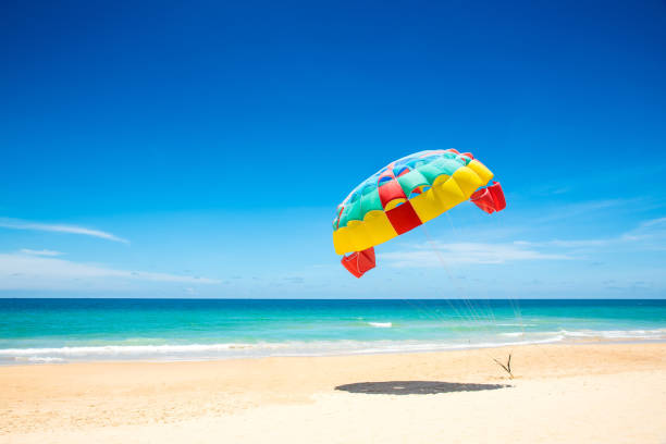 istock Colorful parasail wing pulled by the sea ,Phuket,Thailand. 843139020