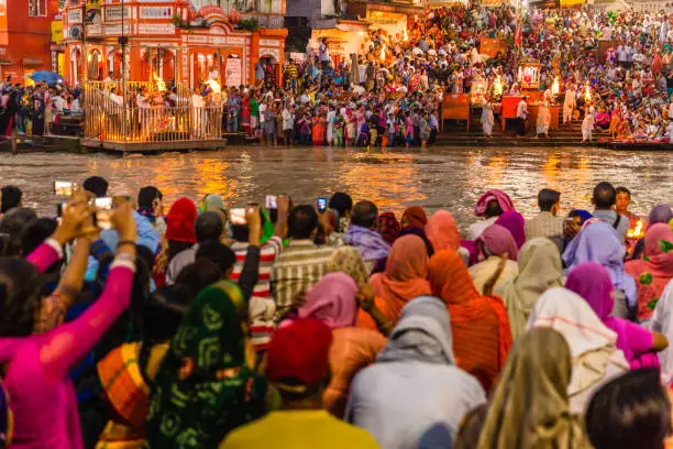 Thousands of Hindu Pilgrims/ People in the holy city of Haridwar in Uttarakhand, India during the evening light ceremony called Ganga arthi to worship river Ganga / Ganges. Culture, Tradition,ceremony