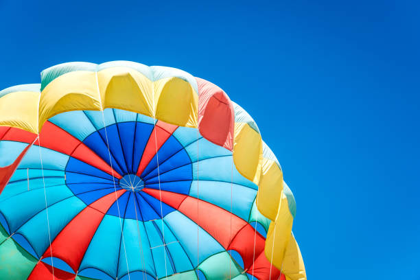 istock Colorful parasail wing pulled by the sea ,Phuket,Thailand. 843139810
