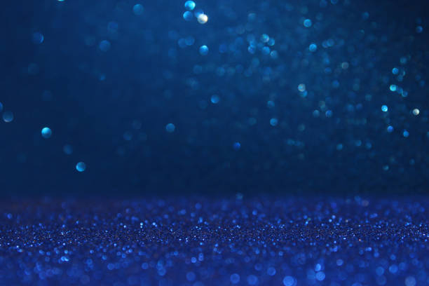 istock glitter vintage lights background. blue, gold and black. de focused 843140284
