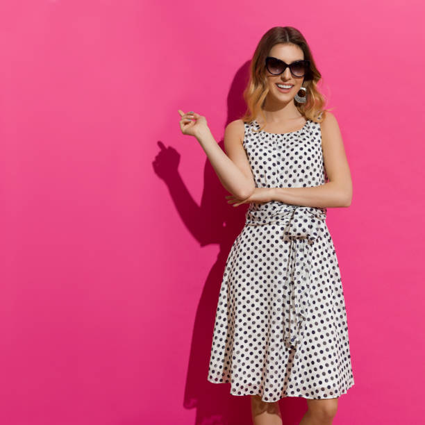 istock Beautiful Smiling Woman Is Posing In Sunlight And Pointing 843140910