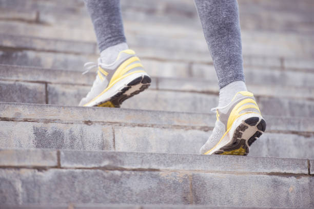 istock Close up active female foot running up stairs. 843143598