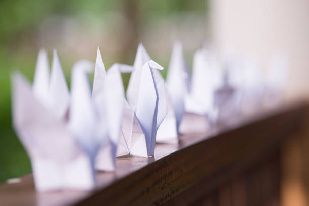 Origami crane bird on white background.