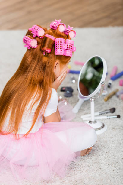 istock girl looking in mirror 843148700