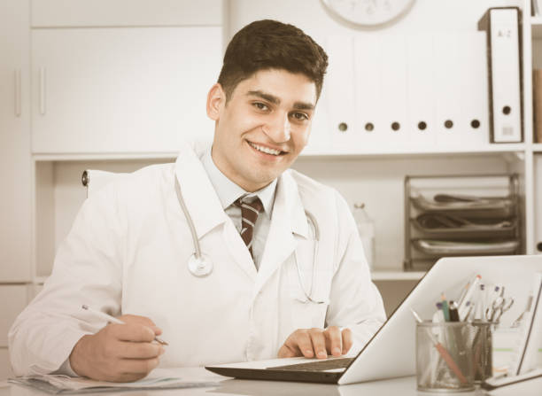istock Professional doctor is doing report about patients 843154820