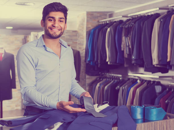 istock Guy is showing jacket and tie that he chose 843155226