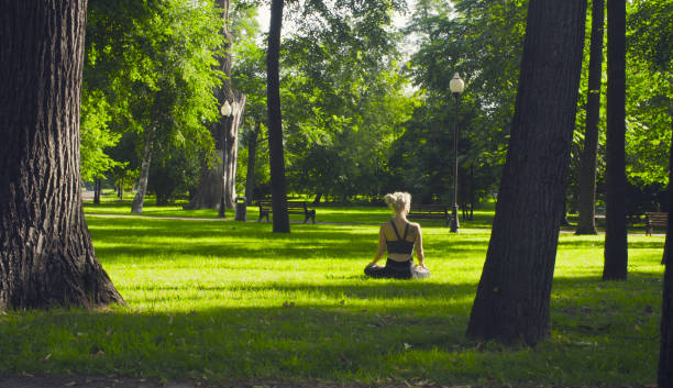 istock A young woman sitting in a lotus pose 843157082
