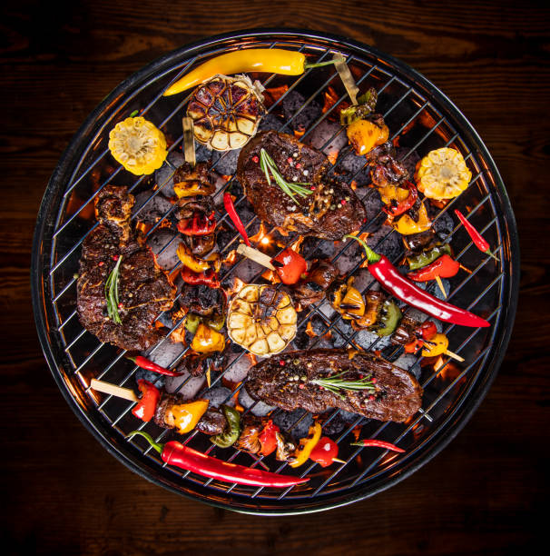 istock Barbecue grill with beef steaks, close-up 843157248