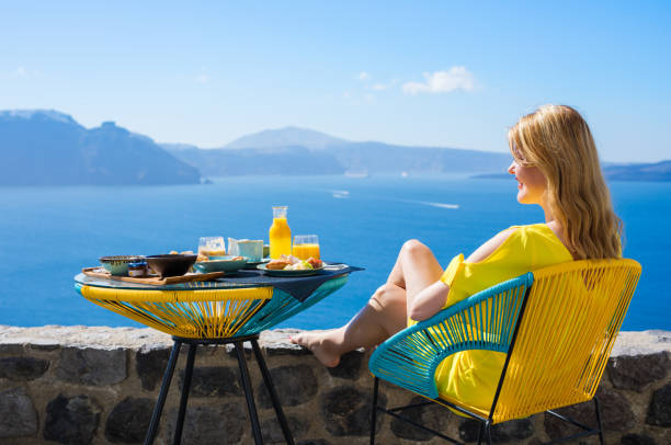 istock Woman enjoying luxurious breakfast with beautiful view from terrace 843163772