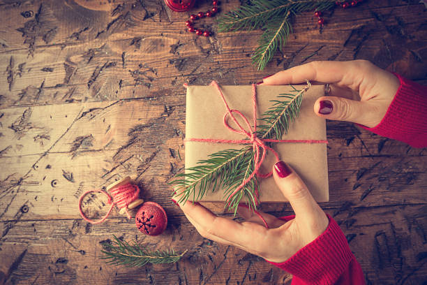 istock Woman's hands give christmas gift 843163778