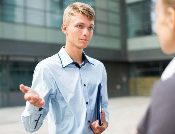 istock Young manager is talking with partner before signing contract 843163904