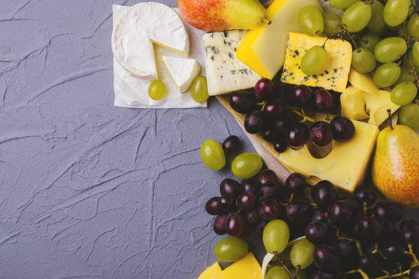 istock Cheese plate served with fresh grapes and pears 843166170