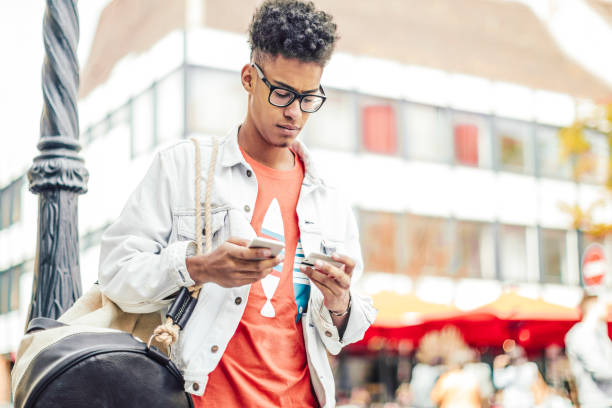 istock Young man using phone in the city 843169886