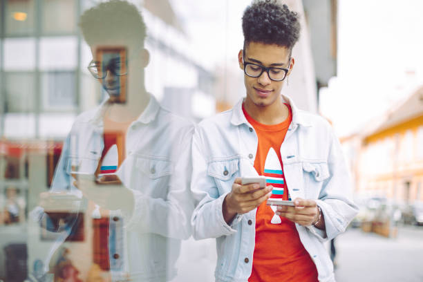 istock Young man using phone in the city 843169940