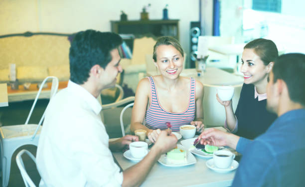 istock Friends meeting and drinking coffee with pastry at cafe 843172864