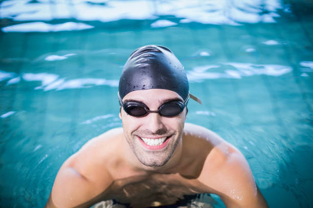 istock Man wearing swimming goggles 843173436