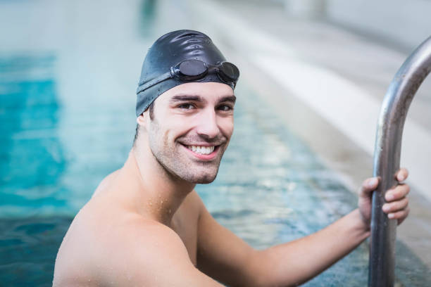 istock Handsome man getting out of water 843173528