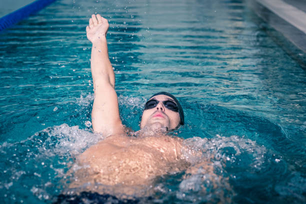 istock Fit man swimming on the back 843173626