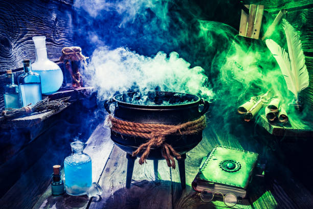 istock Old witcher cauldron with books and scrolls for Halloween 843174094