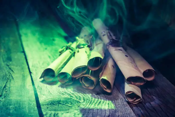 Witch workshop with green light and scrolls for Halloween