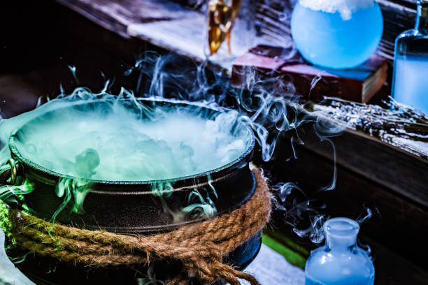 istock Closeup of witcher cauldron with blue potions for Halloween 843177648