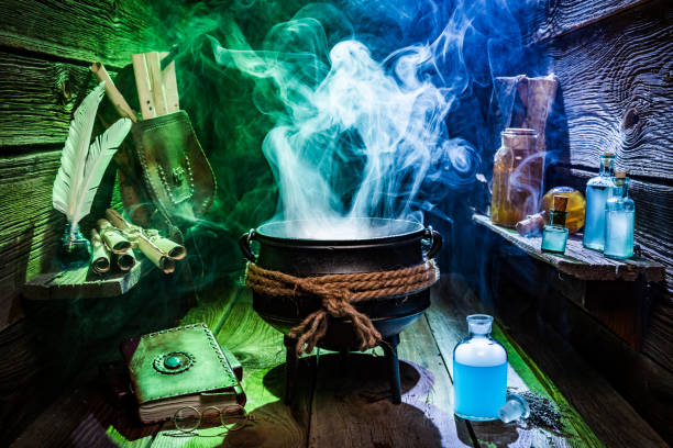 istock Vintage witcher cauldron with magic potions and books for Halloween 843180484