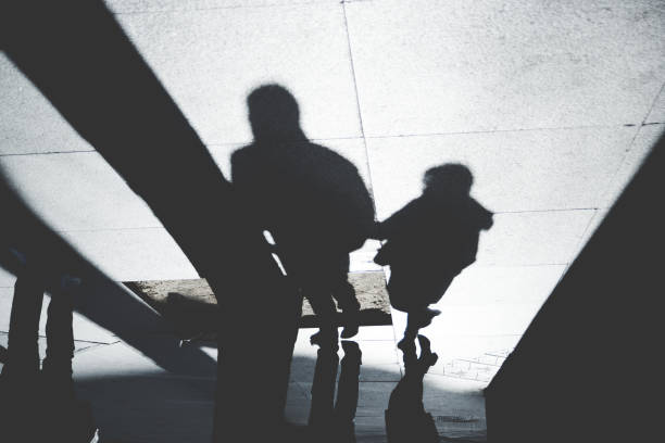 istock Shadow of People on Patterened Sidewalk 843181936