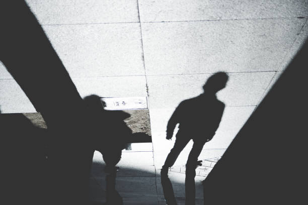 istock Shadow of People on Patterened Sidewalk 843182256