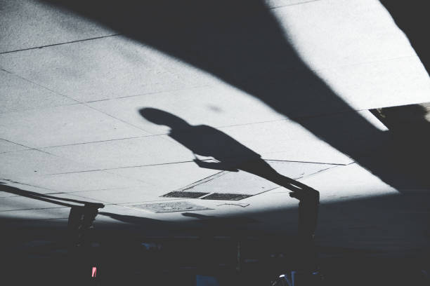 istock Shadow of Person on Patterened Sidewalk 843183586