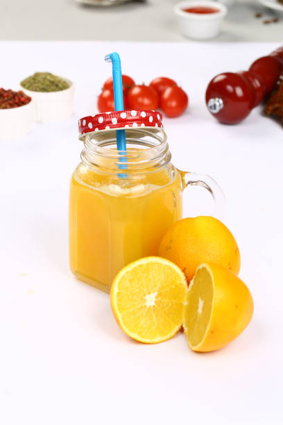 istock Fresh orange juice in glass cup 843183600