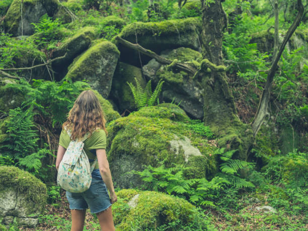 istock Young woman walking in nature 843184052
