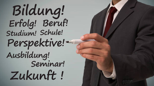 istock Businessman writing several words in german on careers 843184202