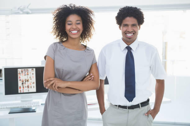 istock Young editorial team smiling at camera together 843189282