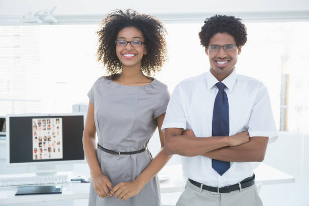 istock Young editorial team smiling at camera together 843189314