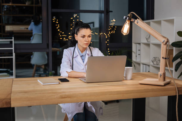 istock Professional serious researcher working on the laptop 843189868
