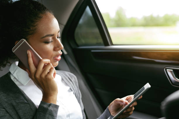 istock Businesswoman talking on a phone and using digital tablet 843192480