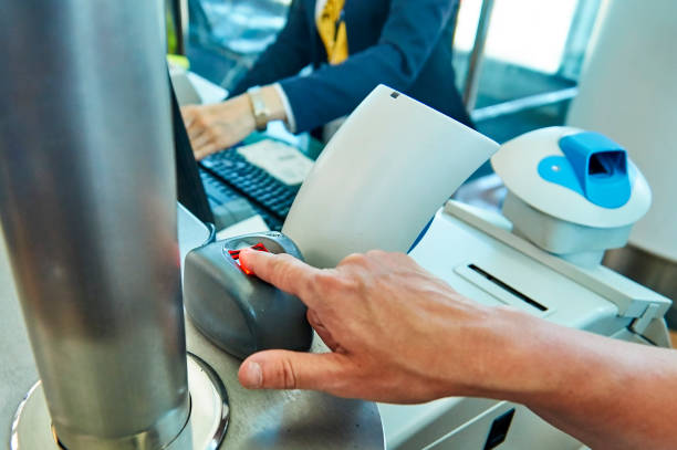 Biometric control of fingerprints in airport. Tourist passes biometric control of fingerprints in airport security barrier photos stock pictures, royalty-free photos & images