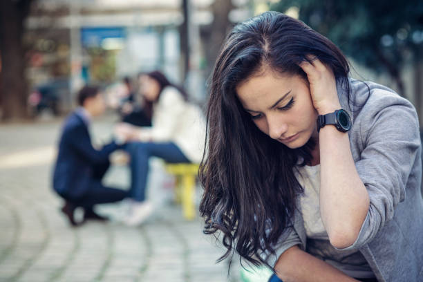 istock Depressed beautiful female holding her head in hand 843197438