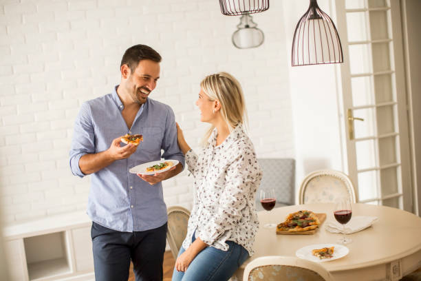 istock Lovely young couple eating pizza 843202870