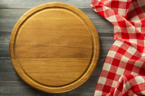 istock Pizza cutting board at wooden background 843206348