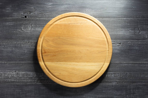 istock Pizza cutting board at wooden background 843206476