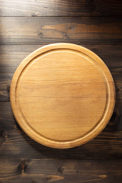 istock Pizza cutting board at wooden background 843206556