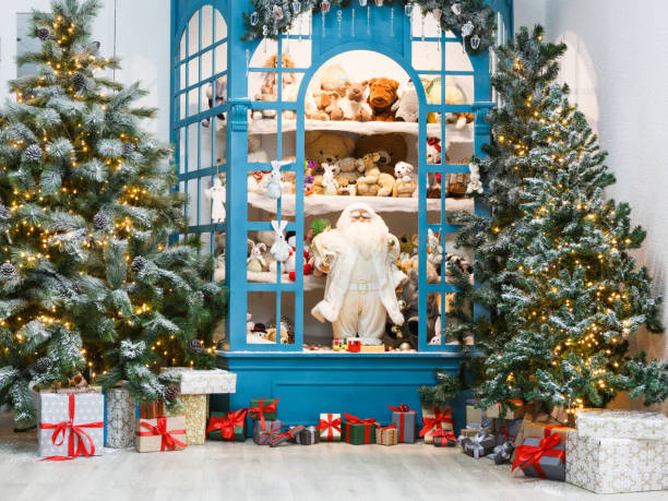 istock Christmas is coming. Decorated fir trees and presents background 843209210